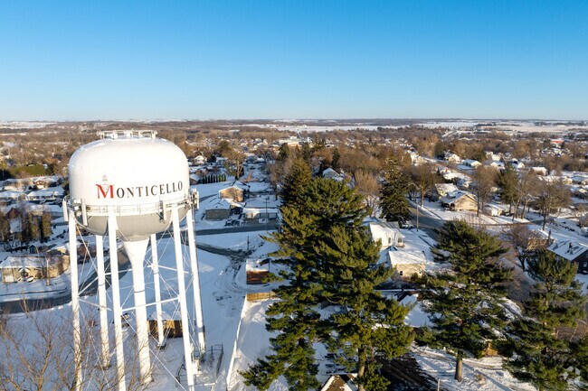 The Monticello water tower stands as a landmark near residential areas and local parks.