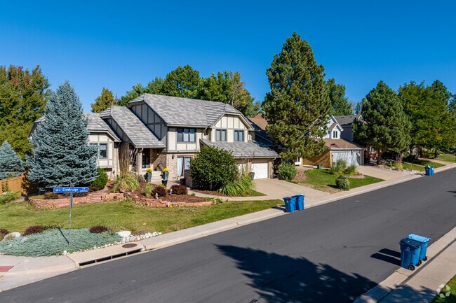 Piney Creek boasts beautiful Tudor-style architecture nestled among lush, tree-lined roads.