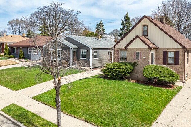 A row of Tudor-style homes show off their beautiful front lawns in President Heights.
