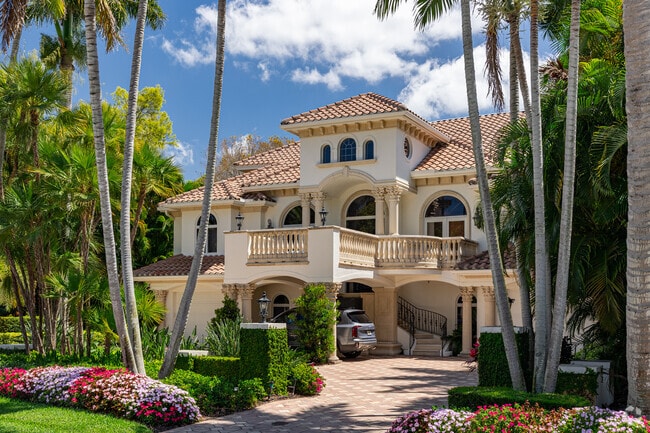 Aqualane Shores features homes built in a Spanish Revival styles, with red tile roofs.
