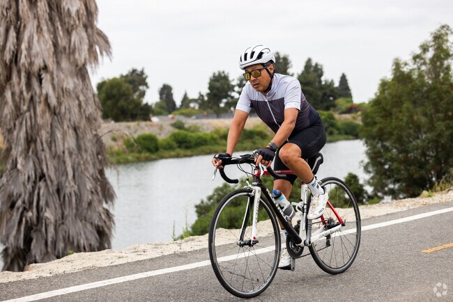 The San Gabriel River Trail flows along the channel and bikeway near Bixby Hill.
