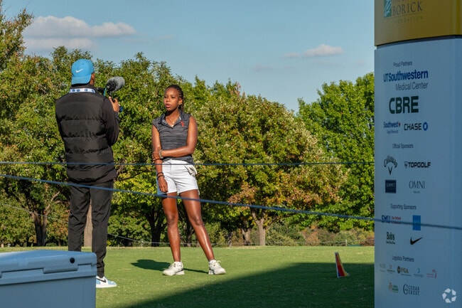 A participant in the annual golf tournament is interviewed at the Cedar Crest Golf Course.