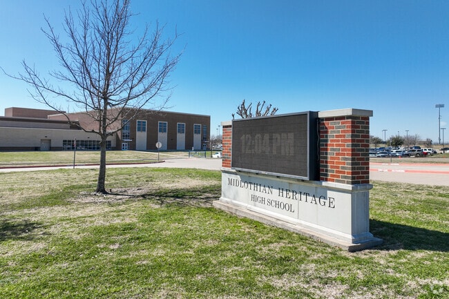 Important annoucements are displayed on the digital sign at Midlothian Heritage High School.