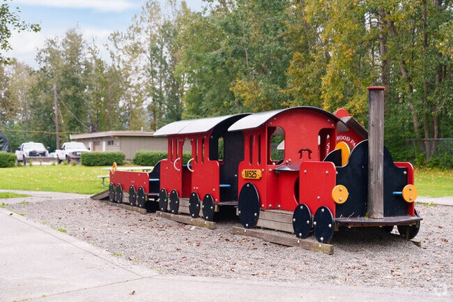 Children enjoy the train-themed playground at Alderwood Park.