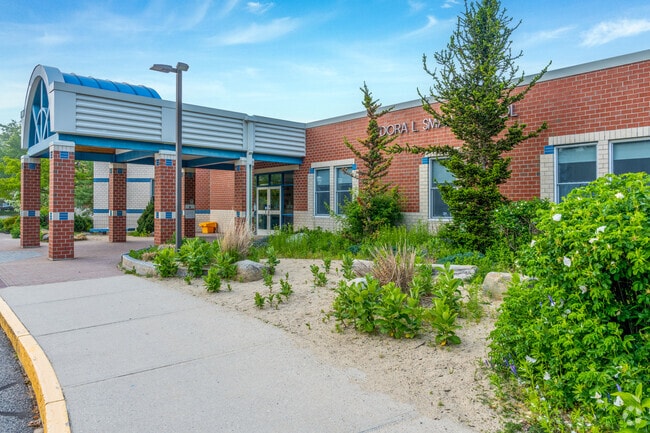 Beautiful landscaping around the entrance to the Dora L. Small School.