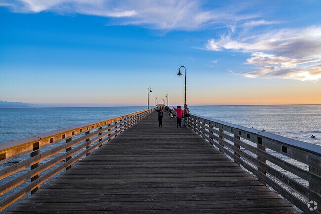 Enjoy a relaxing stroll and the cool summer breeze while walking along the Cayucos pier.