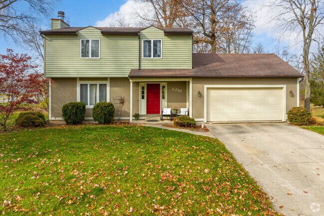 This nice two story in Fort Wayne's Brandonwood features a small front porch with seating area.