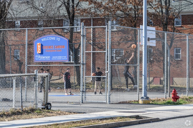 Residents of Prospect Park shoot hoops at Grace Buckley Park.
