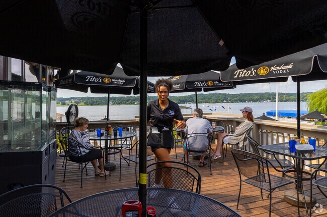 Mars Resort in Como offers shaded outdoor seating with lake views and friendly service.