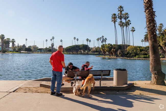 Take your dog for a walk around the pond at Alondra Park in Alondra Park, CA.