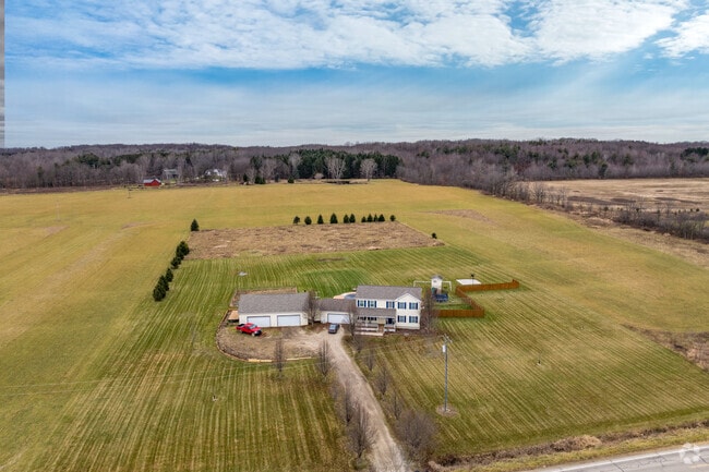 A Colonial Revival rests on a large lot in Marathon Township.