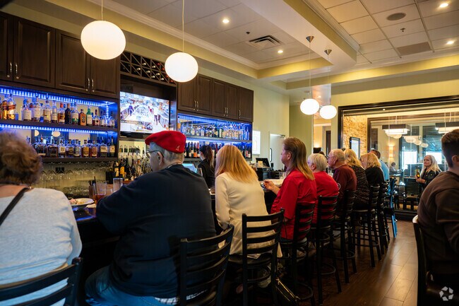 Hamlet locals enjoy a drink at the bar in Malibu Beach Grill.