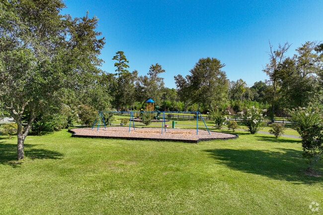 Eugene Lamb Park in Midway features colorful swing sets and a spacious playground for kids.