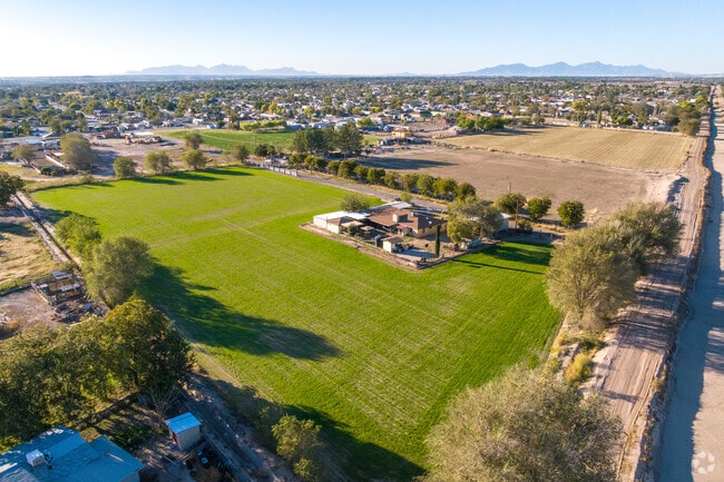 A San Elizario home nestled amidst the tranquil beauty of a hay field.