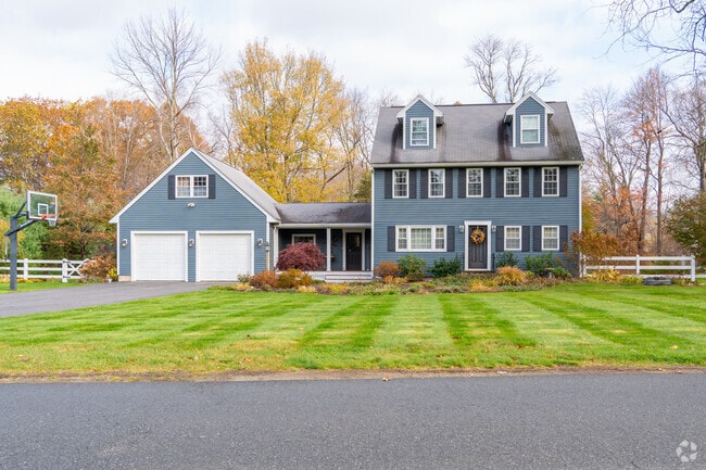 Classic New England colonials add timeless charm to Far West Andover’s wooded streets.