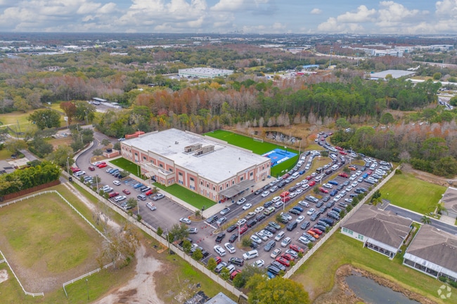 Henderson Hammock Charter School  campus is nestled behind trees for privacy from the roads.