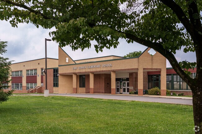 Tree-lined walkways define the peaceful setting at East Goshen Elementary School.