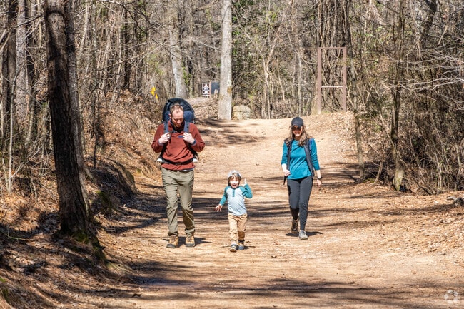 A family hiking together in Red Mountain Park.