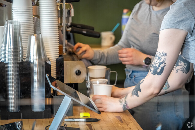 Baristas hard at work for Gilman locals getting their morning coffee on their way to work.