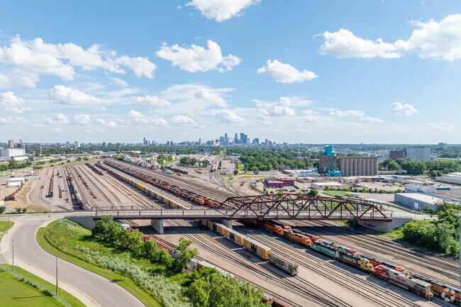 An aerial view of the train yard in northeast with downtown Minneapolis in the background.