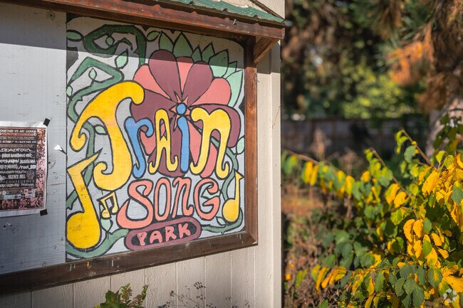 The latest neighborhood happenings are seen on the community board at Trainsong Park in Eugene.