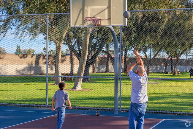 Shooting hoops with your best friend, as the sun goes down, is a good way to end the day.