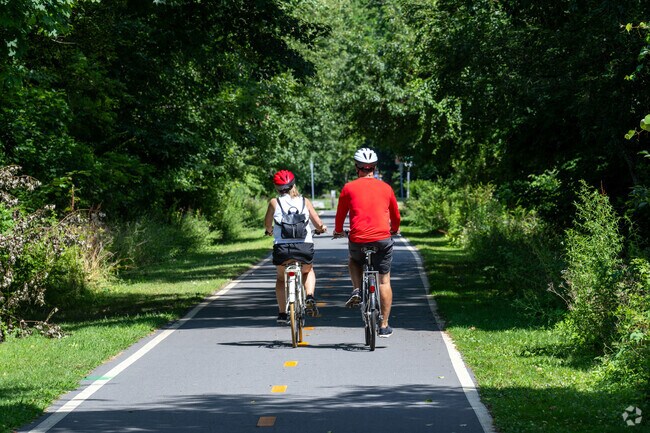 The East Bay Bike Path rolls gracefully along the Barrington neighborhood offering recreation.