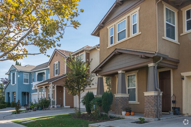 Trees line the streets of these modern two story homes.