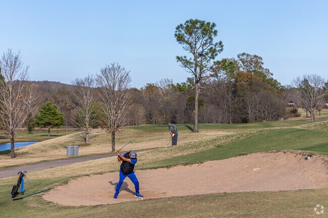 Golfers practice their swing or hit the greens at Stonebridge Meadows Golf Club.