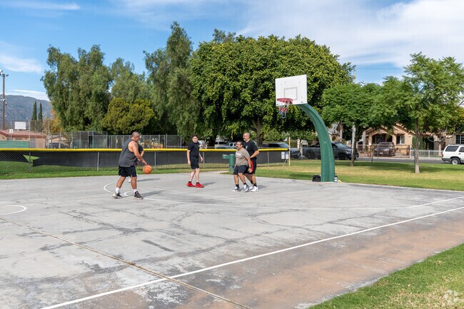 San Fernando locals enjoy a pick-up game of basketball at Pioneer Park.