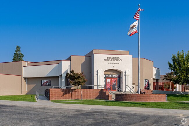 The American flag waves at the entrance to Standard Middle School near North Country Meadows.