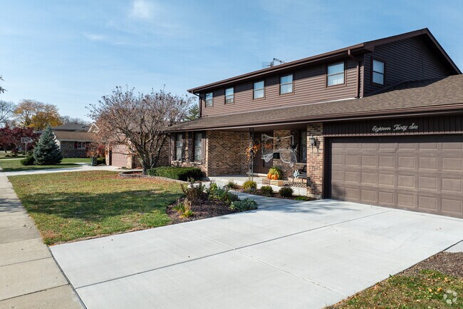 Large driveways with multi-car garages are the norm for the established Ivy Hill neighborhood.