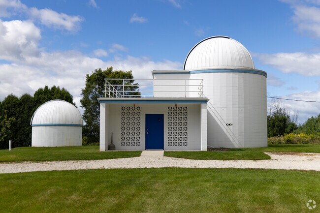 Modine Benstead Observatory features domes with large telescopes.