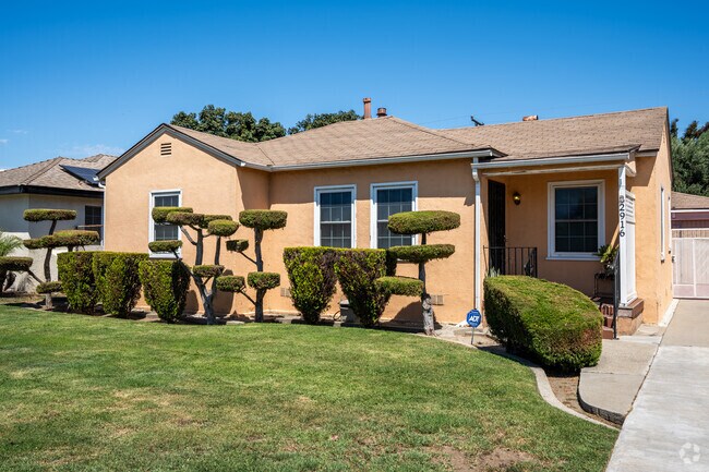 A topiary comlements the front of this ranch home in Upper Westside.