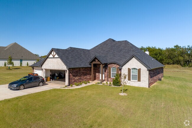 Some Navina homes feature bold red brick accents on its facade.