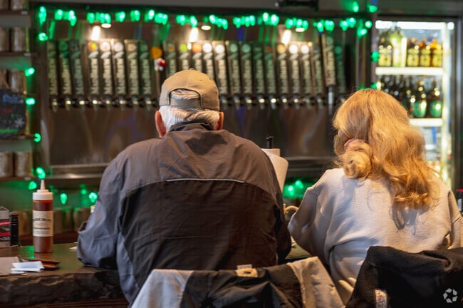 A couple enjoys a pint at Shigs in Pits BBQ restaurant near Northeast Ft. Wayne.
