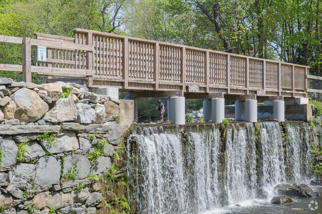 The dam at Silver Spring Lake aerates the water as it cascades gracefully into the stream below.
