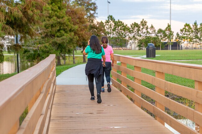 Bear Creek Recreation Complex circles the lake with a long, shaded walking path.