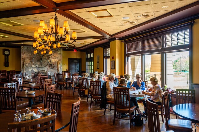 Residents stay cool and play cards at Arrowhead Golf Club.