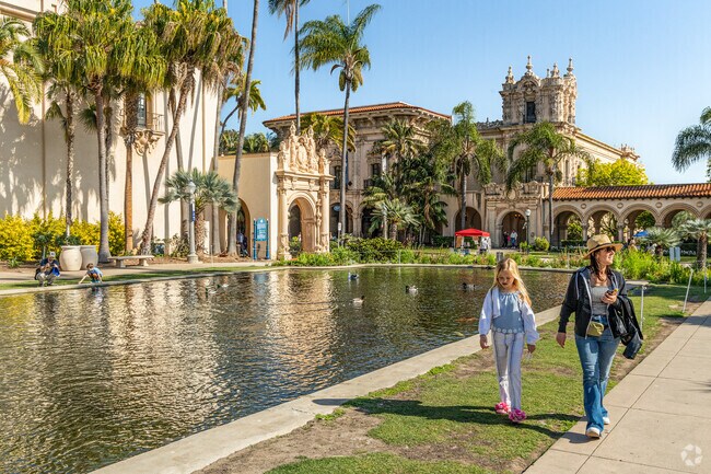 A family enjoys a walk through Balboa Park located near Burlingame.