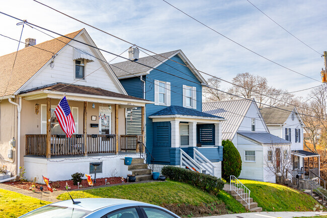 A bungalow sits side by side with an American Foursquare home in Vandergrift.