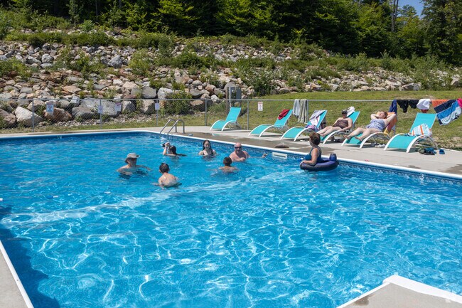 Travelers enjoy a swim at Nature's Wilderness RV Lodge near Parsonsfield.