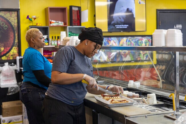 Residents chow down on a delicious hot dog at Pittie Dog Grill in Colonial Place.