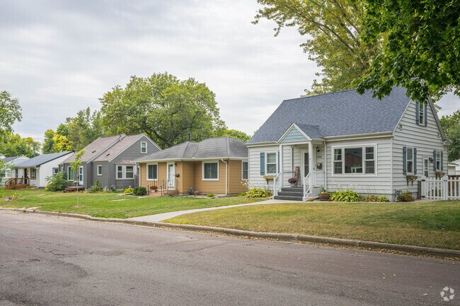A Cape Cod style home on the corner alongside other homes in  Dotson Park.