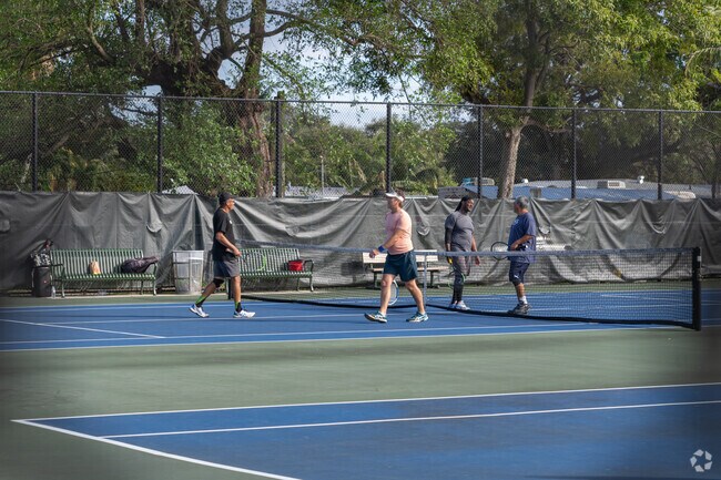 Local Golden Glades residents starting a game of pickleball.