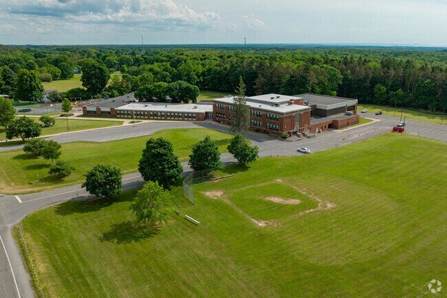 Mannsville Manor Elementary features a baseball field for students.