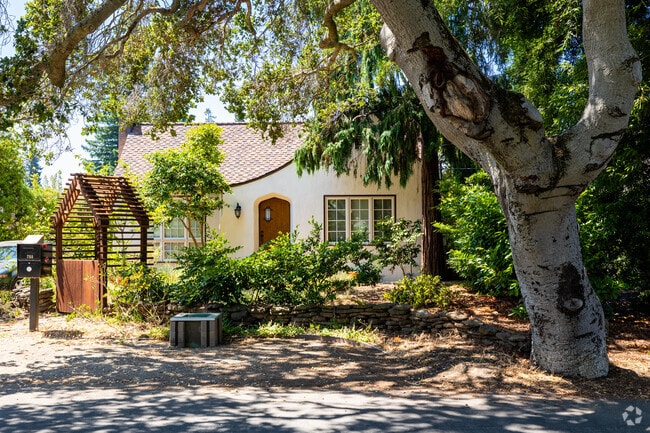 Many homes in Menlo Oaks are shaded by mature oak trees.
