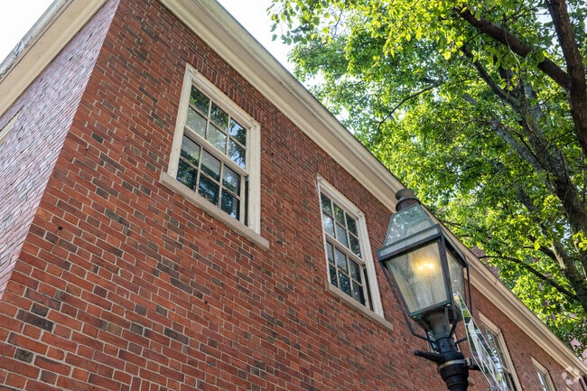 Old lanterns native to the neighborhood welcome you to The Advent School in Boston.