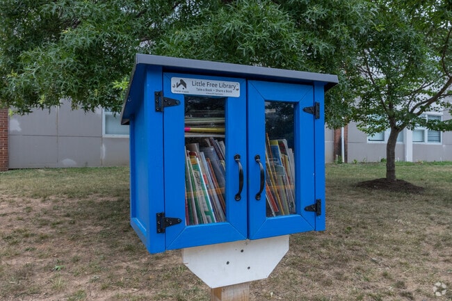 Kids can borow a book from the Parklawn Elementary School free outdoor library in Lincolnia.