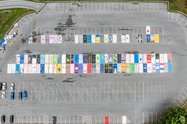 Seniors at Wheeling Park High School paint their parking spots.